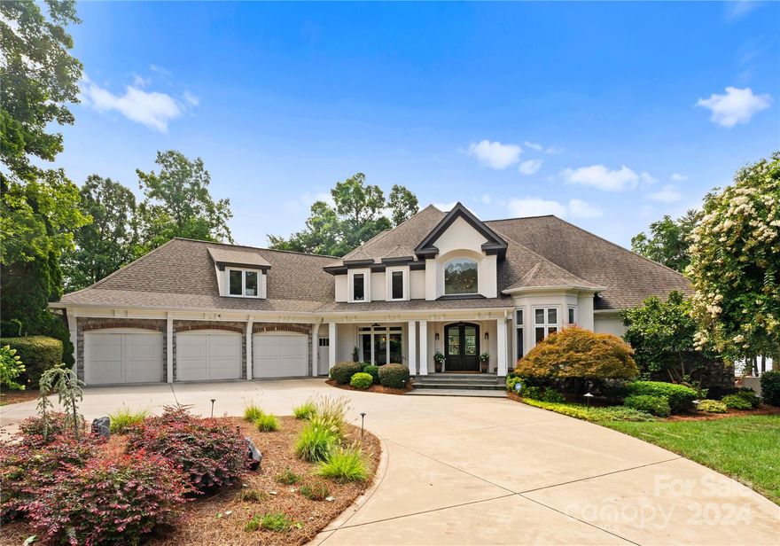An icon of premier Lake Norman living. Say hello to this beautiful waterfront home, located in the sought after Peninsula neighborhood and right on the water of Lake Norman! Captivating long range water views make this property a dream home for any lake lover. Soak in the sun while enjoying a luxurious lakefront pool and hot tub, and enjoy a wonderful private dock with its own boat slip. This property is one of a kind, boasting around 300 feet of shoreline with one of a kind views of the beautiful Lake Norman. Enjoy a luxurious grand foyer along with a marvelous living area with plenty of view of the beautiful lake! Enjoy a beautiful renovated kitchen, walk-in pantry, and luxurious dining room with marvelous interior design. With spacious bedrooms, a home office, two spacious walk-in closets on the main level, and large media room on the upper level, this home checks all the boxes. Garage has newly epoxied floor. Located about 23 miles from uptown Charlotte, this location is wonderful!