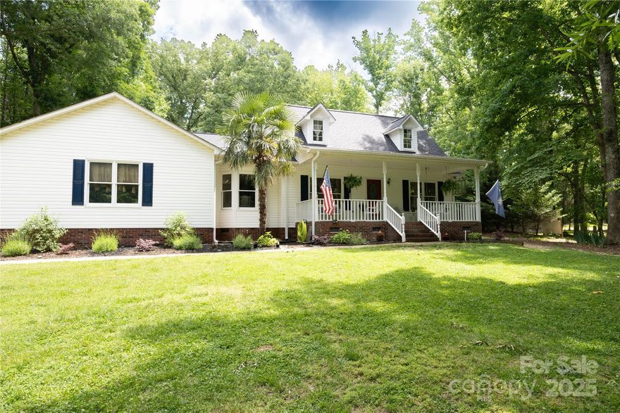 Welcome to this charming 3-bedroom, 2.5-bath home nestled on a spacious 1.69-acre lot. Enjoy peaceful mornings on the classic rocking chair front porch or relax on the updated back deck surrounded by nature. Inside, you'll find a cozy, well-maintained layout featuring an updated kitchen and beautifully remodeled primary bath with plenty of space for everyday living. A large workshop with a window unit offers endless potential for hobbies or extra storage. Bonus: Newer roof installed in 2024 for peace of mind! This one has it all -comfort, updates, and room to grow.