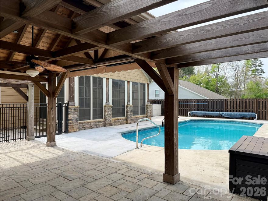 Stunning Craftsman-Style, 3 bedrooms and 2.5 baths, ranch with Bonus Room | The Falls at Cloninger Mill
This beautiful split bedroom floor plan offers over 2,000 heated square feet on the main level, plus a spacious bonus room over the garage, perfect for an office, media room, or guest bedroom. 
Inside, you’ll find hardwood floors throughout the main level, elegantly tiled bathrooms and showers, and exposed beams that add custom character. The kitchen features hand-crafted cabinetry, granite countertops, tile backsplash, stainless steel appliances, and a walk-in pantry. The primary suite boasts a trey ceiling and his-and-her walk-in closets for exceptional storage and comfort. A separate laundry room and powder room add convenience and functionality.
The backyard is an entertainer’s dream, featuring an in-ground salt water pool, gazebo with a dedicated grill area, and gas fireplace, making the space perfect for year-round enjoyment.
Additional highlights include a spacious attached garage, low-maintenance exterior finishes, sidewalks throughout the neighborhood, and close proximity to Lake Hickory and shopping. Located in an established, well-kept community, this home combines craftsmanship, comfort, and the perfect setting for everyday living.