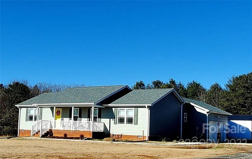 Wonderful rural location with a nice size ranch style home built in 2020 sitting on 2.1 acres  with a 20x20 approx wired shop. Nice open floor plan with 2 bedrooms, 2 full baths, large open great room. Lovely kitchen with granite counter tops, walk in pantry, plenty of countertop & bar space & a large dining / breakfast area with glass doors leading out to a deck area for grilling or just lounging. You will love this covered front porch for your rockers. Large wired work shop for storage or great for hobbies. You will love living here in this almost new home with a nice country atmosphere, no city taxes & only minutes from many small towns.