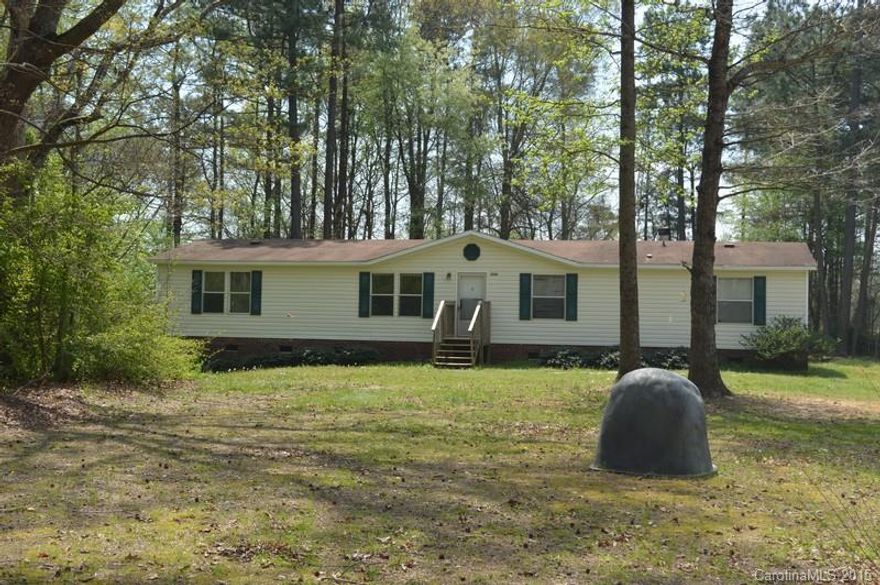 LOTS OF ROOM TO GROW! Over 1 Acre! 4BR 2BA. Living room & Den w/stone F/P W/gas logs. Large Kitchen, laundry room w/large pantry. Needs appliances, all rooms good size! Split BR plan. Walk-in closet in Master BR., Garden tub & separate shower in Master BA. Large yard w/trees, great for Privacy! Storage Building. Home needs little fixing up mostly Cosmetic. Priced Below Tax Value!