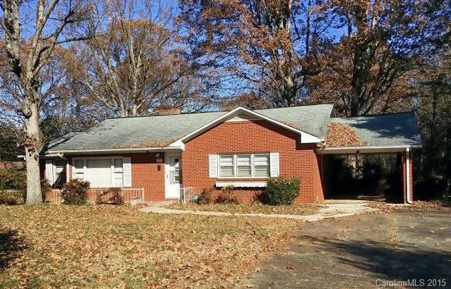 All Brick Ranch nestled on 2.37 acres in Iredell County. Unique property for first time buyers or retirees! This house has it all! 3BR/2BA home w/additional storage bldg in back & 1400 sq ft workshop w/loading dock. Kitchen w/vinyl, range, dishwasher & lots of counter space. Living Rm w/knotty pine paneling, fireplace, carpet & built-ins. Den or possible office space. Laundry on main. Cellar w/work sink & room for canning. Updated furnace & central air in 2008 w/oil backup. Gazebo in backyard.