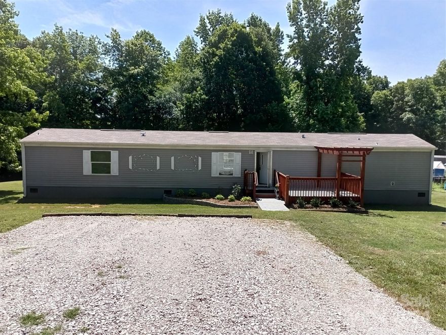 Come to the country with a lake at your back to fish or just relax. Home is 4 years old and in good shape. With a split bedroom concept and plenty of room for all. Over two acres of ground. Enjoy he deck on the front with a pergola. Nice landscaping and ready for your touch!