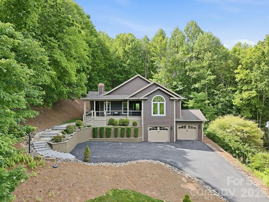 This hilltop beauty has wonderful mountain and trout pond views!  It’s located within the peaceful, gated Avery Park neighborhood adjacent to the Pisgah National Forest.  This home backs right up to the forest itself.  Walk the trails to the Blue Ridge Parkway, if you like.  The home is immaculately maintained and move-in ready.  The main level houses most of the daily used rooms, while the lower/basement level has a 2-car garage, bonus room and 4th bedroom with its en suite bath all at ground level. A delightful bonus is the screened porch out back, with loads of privacy for your relaxing pleasure.  Avery Park has a great amenity package with a trout pond, pool, pickleball/tennis court, basketball court, playground, pavilion with picnic tables with a gas grill and a clubhouse.  So close to town, yet feels far removed; a great combo!