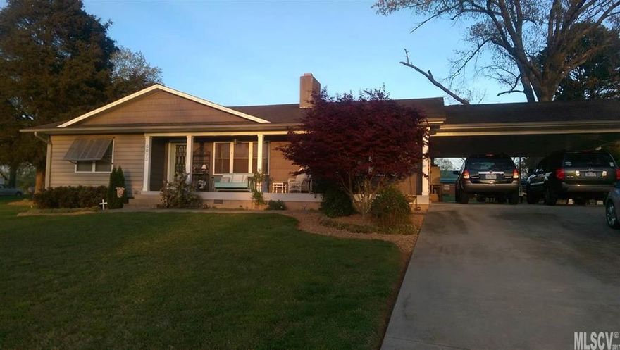 EVENING SHADE!!  This lovely 3 bedroom, 1 and a half bath home is quite a charmer.  The large private lot sets back from the main road for quiet enjoyment. The lush lawn and mature landscaping make for relaxing evenings outside. The current owners use part of the large 2 car carport as a sitting area.  Inside, the home has a large open concept kitchen/dining area with lovely hardwood floors. Down the hall is a separate, cozy living room before leading to the bedrooms and bath. New windows and entry doors in '04.  This home is a must see, you'll feel right at home.