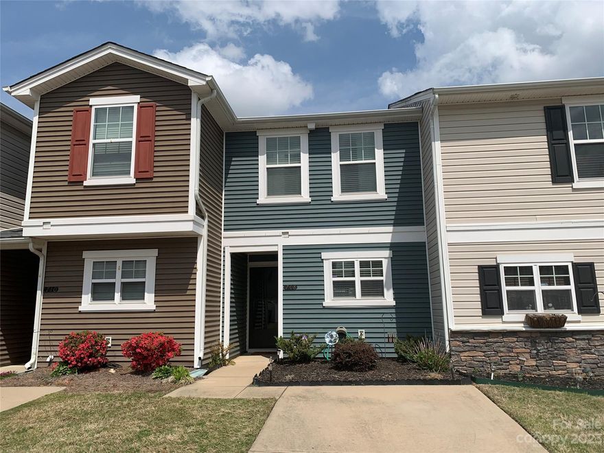 Charming townhome in Gated community situated along large common lawn just beyond the pool and clubhouse. Sliding glass doors open the large living space on main onto your own private fenced patio. And only minutes from I77! Community only recently replaced the building's roof. Interior has been well cared for with LVP throughout main floor. Such a cute kitchen with white cabinets and tiled backsplash. Convenient stacked washer/dryer included in US laundry closet. Home is in move-in condition. Special opportunity in convenient SC location.