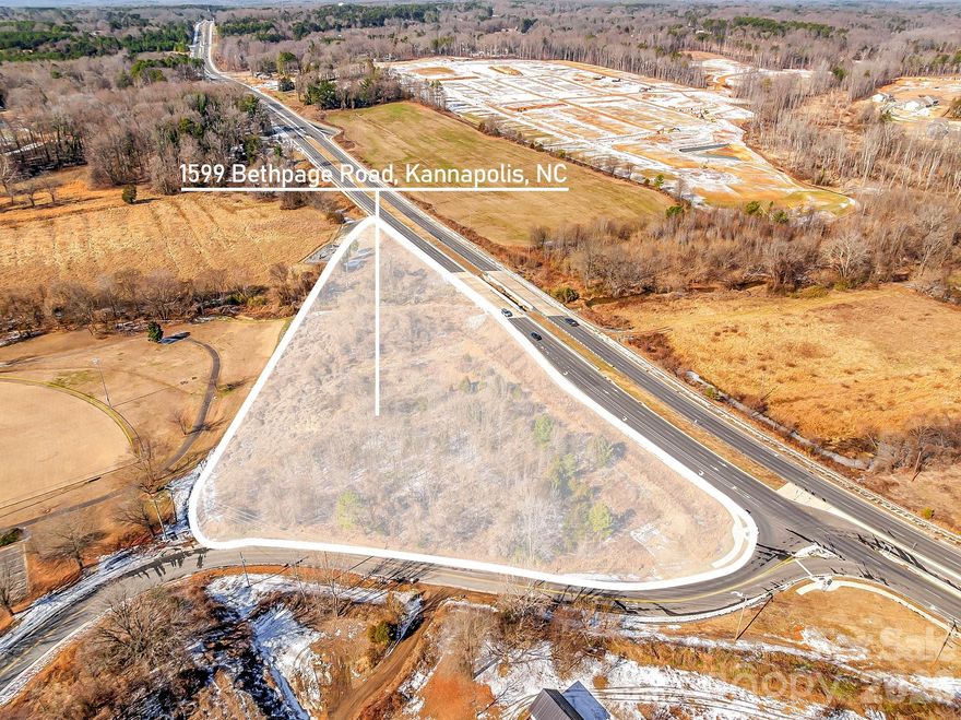 Here is your opportunity to own/develop land on HWY 3 minutes to revitalized downtown Kannapolis. Property is currently zoned R8 which allows 8 dwelling units per acre subject to other ordinance requirements. R8 zoning allows for commercial uses in certain situations. Since property is on HWY 3, the zoning could be changed to commercial pending approval from the city. Additional pictures show downtown Kannapolis and all that it has to offer. Property is located across from the new Summerlyn Village by Lennar homes which features a mix of new single family homes and townhomes. Don't miss your chance to own a piece of prime real estate!