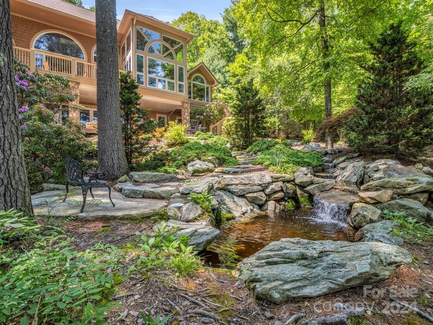 Spacious Home on the 5th Fairway, in the Prestigious Member Owned Golf Course Community of Champion Hills, a  Tom Fazio's Masterpiece Golf Course. Rated One of the Best Golf Courses in the Nation. As you enter the home,  you are greeted by a Wall of Windows with Golf Views & a Gorgeous Floor to Ceiling Stone Fireplace. Renovated Kitchen has a Breakfast Nook with Beautiful Views! Four Seasons Room. Primary Suite on the Main Level- Main Level Living at it's best. Basement has a Large Family Room with Stone Fireplace, 3 Bedrooms, 2 Baths, Bar & Storage. Plenty of Places to enjoy outdoors with Open & Covered Patios, Deck, Manmade Water Fall w Small Pond & Fire Pit, all on a Large 1.15 Acre Private & Secluded  Treed Lot. Amenities=Golf Course, Tennis, Pool, Club House, Dog Park & Fitness Center. 10 Minutes from Dwtn Hendersonville & Medical Facilities. Looking for a Beautiful Home in an Idyllic Setting, This Is It!!