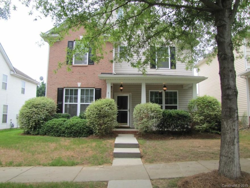 Enjoy the quiet neighborhood as you relax on the front porch of this pretty home! Beautiful HW flooring throughout much of main level. Floor plan incl formal LR & DR with crown molding & wainscoting. Open GR with gas fireplace is adjacent to spacious kitchen with 42" cabinets, pantry & breakfast area. Upper level houses 3 bedrooms, including master suite. Large private master bath has his & her vanities, garden tub, separate shower & walk-in closets. Entertain on patio in large backyard.