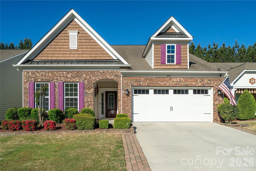 Immaculate 1.5 story, desirable Dorchester floor plan in Carolina Reserve in Indian Land.  4 Bedrooms and 3 Full Baths, with gorgeous wood floors downstairs in common areas.  Open concept living with huge kitchen island, spacious kitchen with lots of cabinetry, stainless steel appliances and  breakfast area!  Gas burning fireplace in the large GR, and  lots of windows and natural light throughout the home.  The owners retreat on the first floor includes a sitting area with exit to the three season sun room.  Split bedroom plan offers two additional secondary bedrooms and full bath.  Upstairs there is a large loft and bedroom with full bath and walk in closet!  The rear yard has a gorgeous paver patio with built in grill, large seating area and full irrigation system with separate meter.  This home offers great space for relaxing or entertaining inside and out.  The community provides a resort-like ammenity package:  clubhouse, fitness center, outdoor pool, dog park, walking trails, and playground.  Just minutes to dining, shopping, Costco, and Target!  Totally and carefully cared for, the home can be yours! Washer, dryer, refrigerator to remain as does the whole house built in speaker system with Denon receiver.  See list of upgrades in associated document section.  Too many to list!