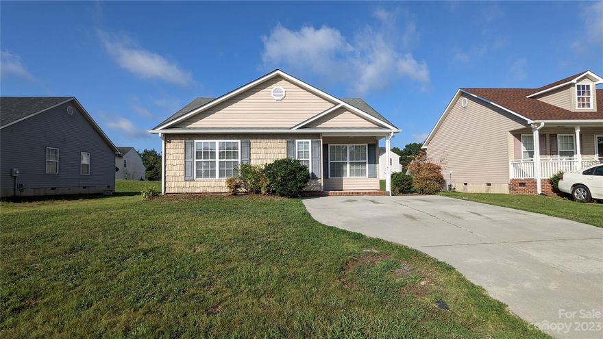 Move In Ready!!!  3 Bed/2 Bath Ranch Freshly Painted a Bright Neutral Color & New Carpet Through Out.  Open Bright Sunny Floor Plan w/Vaulted Great Room & Spacious Kitchen.   Split Floor Plan Features a Spacious Primary Suite w/Trey Ceiling & Walk In Closet.  The Kitchen has Breakfast Bar, Plenty of Cabinets & Counter Space.  Covered Front Porch & Deck on Back. Centrally Located to Schools, Shopping & Dining.