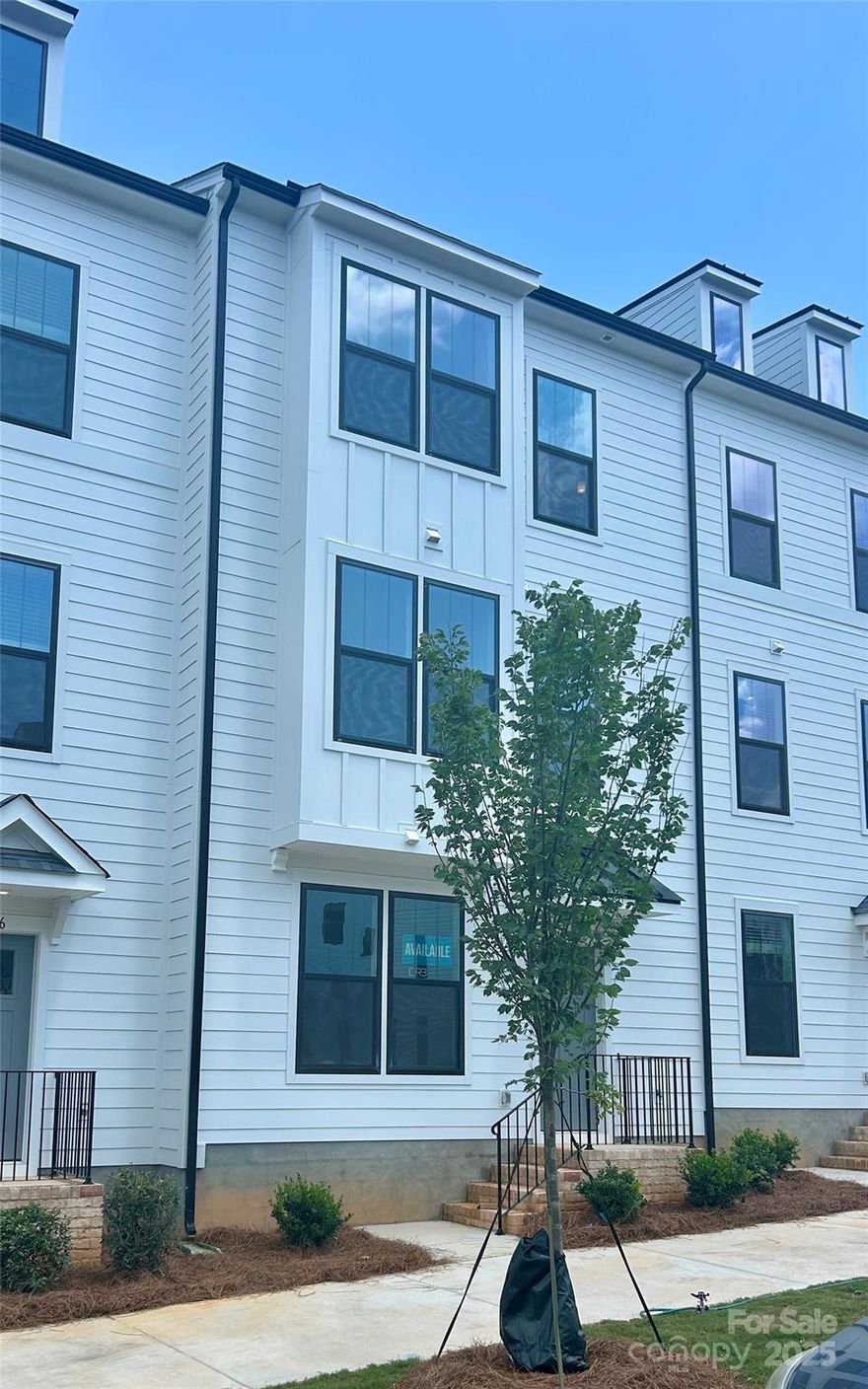 The Landon plan is a 3-story townhome that boasts 3 bedrooms with 2 primary suites 3rd level, 3.5 baths total, bedroom & bathroom on 1st floor and 2-car rear-load garage! Walk up the stairs to your light & bright second level where you’re greeted by a spacious great room & Gourmet Kitchen featuring an oversized island, SS appliances, 5-burner electric drop-in cook-top, wall mount range hood, wall oven & wall microwave, tile backsplash & SS undermount sink. The perfect space for entertaining! The 3rd level suites feature large walk-in closets with dual sinks, tile floor, walk-in tile shower with semi-frameless glass door & tile seat. Laundry on 3rd. Water & Sewer & Trash are included in HOA dues. Location, Location! Ask about up to $10k flex cash toward closing costs/prepaids with approved lender.