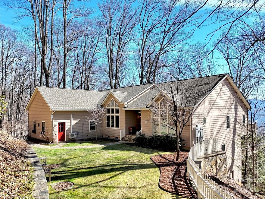 Discover the ultimate in privacy & tranquility with SIX plus acres in Laurel Ridge Country Club with breathtaking vistas. The moment you open the front door, you are captivated by the VIEWS & the floor to ceiling windows. This 4 bdrm, 3 bath home is beautifully appointed throughout!  Everything you need is on the main level, including an Office/2nd bdrm & full bath. Spacious primary suite w/luxurious bath w/marble countertops & shower. Gorgeous custom kitchen w/gas range, double ovens, wine cooler & warming drawer.  Open floorplan has a gas fireplace in great room & dining area opens to a screened porch to soak in the beauty of the seasons. Lower Level has 2 bdrms, full bath & a spacious family room/recreation area for family & guests. Fenced yard, flanked by stonewalls, perfect for pets or a private garden oasis. Experience the beauty & peace of mountain living, just minutes to Laurel Ridge CC & downtown Waynesville. 3 car garage/ workshop. 2 Trane HVAC (2018) Generator & Roof (2020)