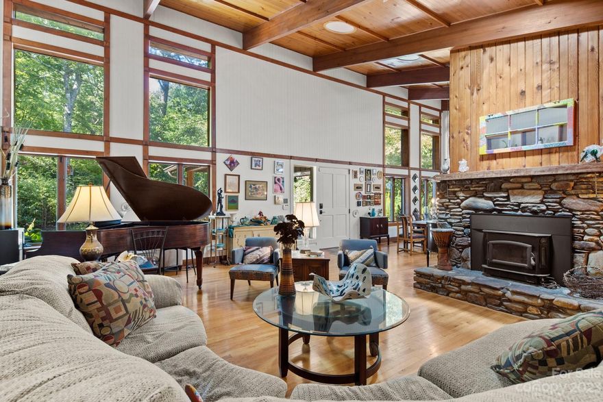 An Amazing Opportunity for a McDowell Co. STR, Vacation Home or full-time home. Spread across a generous eleven (11) acres w/ lush landscape & trails, this secluded and gated haven offers the perfect blend of tranquility and luxury, yet just a gorgeous 10 minute jaunt to Blk Mtn amenities. Recent upgrades include:custom greenhouse with hot tub, spacious garage with room for workshop, dog run, chicken coop, dry sauna, artisan fountain, huge screen porch, separate large shed with electric, solar panels, electric privacy gate, zoned hvac, cherry cabinets and new cool granite countertops in kitchen & two primary suites!.Secluded from the hustle/bustle of the world, this quiet oasis combines the privacy you desire with the wonders of nature. STR allowed, HOA is voluntary. don't miss the Artesian water supply just before the Eastern Continental divide on Hwy 9 or go just a little past HR Acres for lunch/dinner at the Straightaway Cafe! Priced $75K below current December 2023 appraisal!