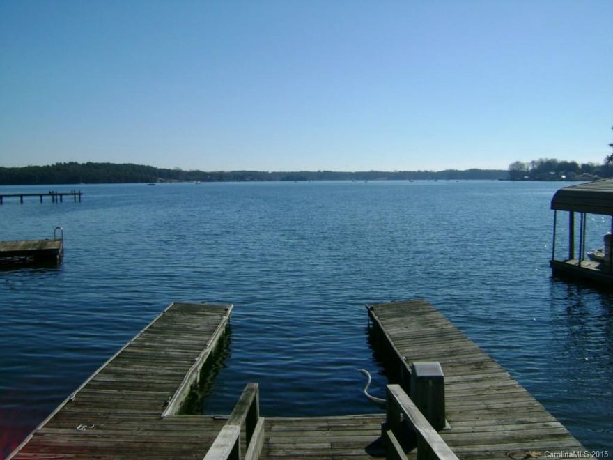 Awesome Lake Norman vacation home with 2 mile main channel views! Floating dock with slip & boat lift. Huge great room & full length deck overlooking main channel. Updated bath and eat-in kitchen. New roof - replaced May 2015. Deck & dock resealed. Dual pane windows replaced in 2012. New compressor July 2015. Priced under $400,000 this will not last long!!! 2nd bedroom does not have a closet.