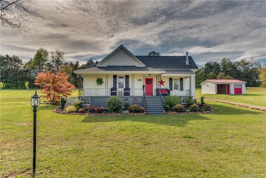 Charming updated country farm house on 4.45 acres of rolling grass and mature trees with a view of the mountains from the kitchen.  Addition of master bedroom and bath in 2012, as well as many upgrades and improvements to the kitchen, and rest of the home.  Two heat pumps. Wood stove in the living room, original fireplace in middle bedroom not in use.  Plenty of attic storage!  Detached carport with storage room.  Plenty of room to garden or fence for a horse or other farm animals.