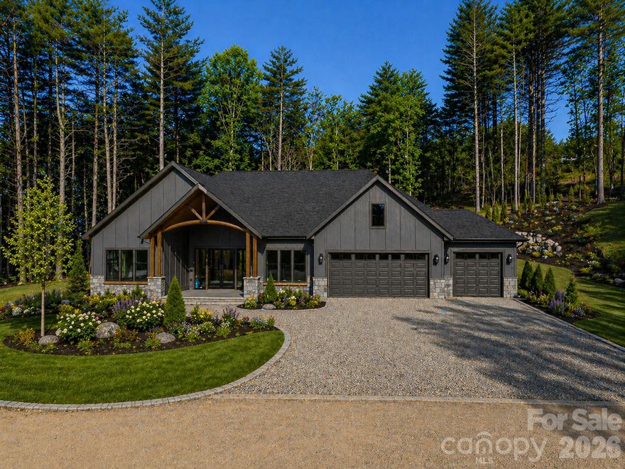 Unwind and enjoy this modern 3-bedroom, 3.5-bath home nestled in the gated community of Horse Shoe Cove. Designed for comfort and entertaining, the open-concept layout connects the chef’s kitchen, great room, and dining area seamlessly. The expansive island features a large sink and elegant waterfall granite, while top-of-the-line Thermador Energy Star appliances add both style and efficiency. The spacious walk-in pantry includes a beverage refrigerator and ice maker—both premium upgrades.
The luxurious primary bath showcases an oversized free standing tub and a walk-in shower with multiple shower heads for a spa-like retreat. Every bathroom features heated tile floors for added comfort. Step out to the screened porch with its built-in grilling station and beverage fridge, or relax in the private hot tub overlooking the beautifully landscaped premium lot.
 The three-car garage boasts an epoxy-coated floor and contemporary doors that complete the sleek, polished aesthetic. Perfectly situated among the rolling hills between Hendersonville, Brevard, and Asheville, Horse Shoe Cove offers an ideal blend of privacy, luxury, and convenience.