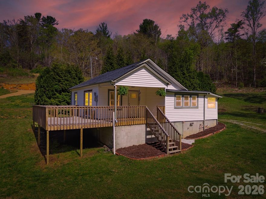 Welcome to this charming home that boasts loads of curb appeal, featuring a newer, expansive wraparound deck perfect for entertaining or simply enjoying the serene surroundings. The property is set on a nice flat yard, offering ample outdoor space and enhanced privacy, surrounded by beautiful scenery that creates a peaceful retreat.

As you step inside, you are greeted by stunning hardwood floors that flow throughout the living areas, complemented by modern touches that elevate the home's aesthetic. The kitchen is a highlight, showcasing beautiful cabinetry that provides both style and functionality, along with a large kitchen island that serves as the heart of the home, ideal for cooking and gathering with family and friends. 

Natural light floods the open layout, enhancing the inviting atmosphere and making each space feel warm and welcoming. The combination of thoughtful design and practical features makes this home a must see, perfect for those seeking comfort and elegance in a tranquil setting!!