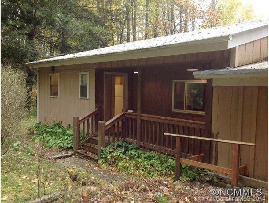 Your sweet rustic cabin in the woods!  Enjoy quiet afternoons listening to the creek and the numerous bird species. Warm wood throughout and large stone fireplace make for cozy evenings. Newer kitchen, bath, front covered porch and side deck, ample storage make for comfortable living, seasonal or year round.  All surrounded by 27 acres of mountain forests with two bold creeks, seeps, and springs.   Only 10 mins to WCU and under 30 to the Smokies!