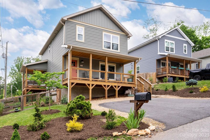 Beautiful and immaculate home with solar power located just south of Biltmore Village on a charming street! Lots to love including a gorgeous kitchen with black stainless steel appliances and a breakfast bar, two covered porches, and a fenced-in backyard. Lovely landscaping provides great curb appeal and the yard is very usable but also low maintenance. All bedrooms + two full bathrooms on the upper level. The primary suite is spacious and the primary bath has a dual vanity. There's a powder room on the main level for guests. Solar panels ensure excellent savings on electrical costs and there is zoned heating and cooling. Wonderful street with several new construction homes in a super convenient location just 1 mile from Biltmore Village shops and restaurants and 3 miles to downtown Asheville.