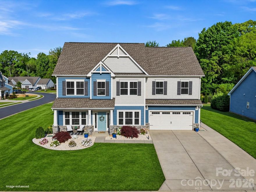 Situated on a prime corner lot in the serene Greenbrier neighborhood, this beautifully maintained home features low-maintenance fiber cement siding and two inviting outdoor spaces: a covered patio and a custom paver terrace, perfect for entertaining.  Both overlook an oversized flat backyard, primed for a pool!  Inside, you will find a open concept floor plan.  A private office, a formal dining room, and a modern open concept kitchen with quartz countertops, black stainless-steel appliances, a butler’s pantry, and a bright breakfast area overlooking the backyard.  The kitchen overlooks the the living room, with its custom built ins, gas fireplace, making it an ideal place to relax. Upstairs, four spacious bedrooms include a primary suite with a sitting area and en-suite bath, a Jack-and-Jill bath shared by two bedrooms, and a private bath for the fourth. Enjoy access to a community pool, Union County’s top schools, and low taxes.