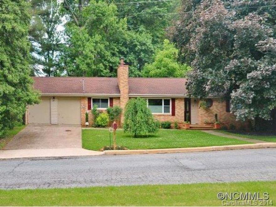 Well maintained ranch home on .91 A with newly refinished hardwood floors in living room and dining room. Remodeled kitchen features granite counters, island, cork floors and built-ins. Opens to spacious deck. Lower level with large family room, 2 bedrooms and full bath (bath just under 7', not in sq footage) perfect for guests; spacious storage areas too. Fine neighborhood with excellent amenities close by. Home warranty.