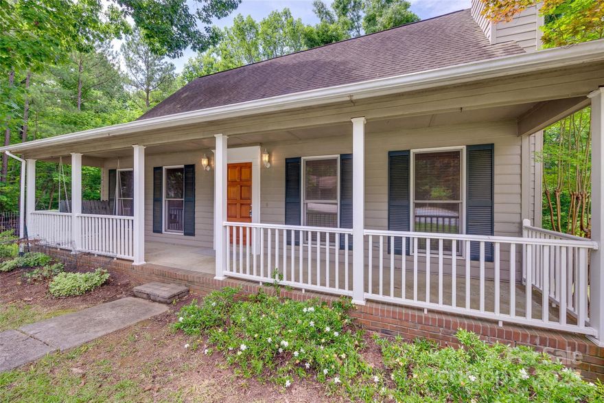 Imagine yourself unwinding on the rocking chair front porch, hosting BBQs on the large back deck, or enjoying a quiet evening in the screened-in back porch. The main level boasts a spacious primary suite, while the second level features two generously sized bedrooms. Both full bathrooms have been tastefully renovated, blending modern comforts with timeless style. The basement features a large storage area/workshop, a spacious laundry room, and a separate room that's ideal for an office, study, or craft room. Parking is a breeze with the oversized carport. The great room, complete with a cozy fireplace, is the heart of the home. 

This home is nestled in  Tega Cay - a fantastic waterfront community, complete with a golf course, lake access, walking trails, a marina, tennis and pickleball courts, a beach, and a club. Plus, you'll have easy access to the interstate, airports, shops, and restaurants. Fabulous Fort Mill Schools.
