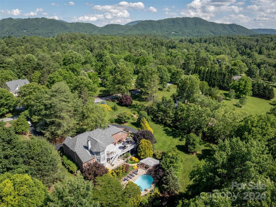 Located in the pastor setting of White Oak Plantation, an upscale neighborhood off Williams Rd.  This home offers the perfect balance of charm and elegance from the foyer to the formal living and dining rooms segue to two story great room with gas fireplace, adorned with natural light leading to updated kitchen with abundance of cabinetry and counter space, large island, and upscale appliances including Sub Zero refrigerator, gas cooktop and double ovens. Perfect for entertaining with access to rear deck overlooking mature landscaping, inground heated pool, and raised beds.  Primary bedroom en-suite with walk in shower and soaker tub, Library, and mud area located on main. Upper level has split bedroom plan with additional bedrooms and play/game room. Lower level with lots of natural light, additional living area, billiard room, ample storage, and privacy for guest with additional bedroom ensuite. Convenient to airport, shopping, dining and all S. Asheville has to offer.