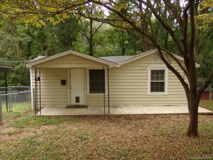 Great wooded 1/4-acre lot convenient to Hwy 321, quick drive to downtown Gastonia & easy access to I-85. Extensive fencing makes this home perfect for dog lovers. Two exterior storage buildings (one wired). Newly added closet to second bedroom, new flooring. Large deck great for entertaining. Digital thermostat and security system. Less than 10 minutes to Eastridge Mall, Gaston Memorial Hospital and less than 5 minutes to Gaston College.