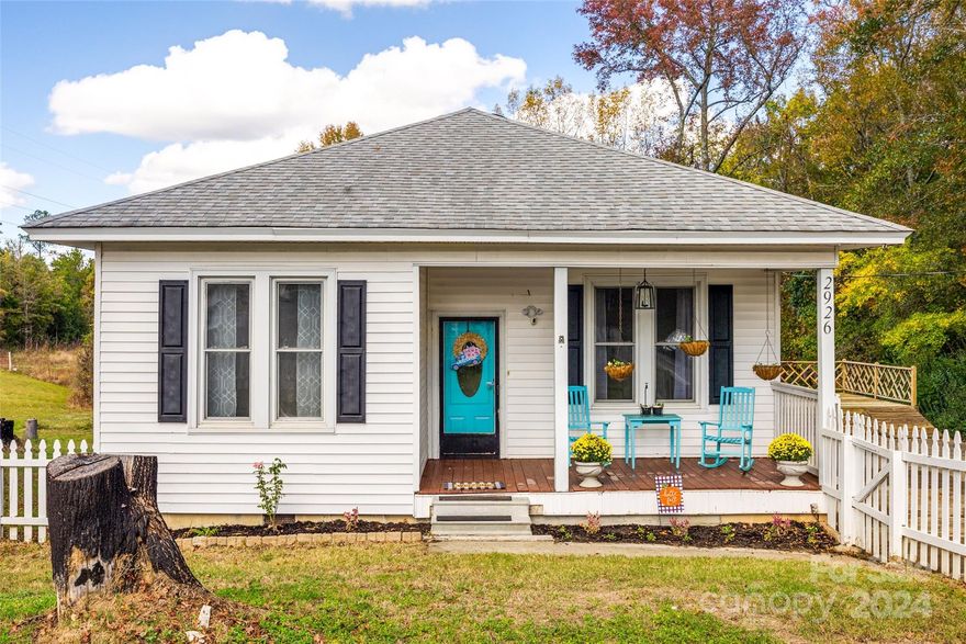 Charming old farmhouse with a white picket-fence on over an acre of land with an over sized one car garage shop and a small barn. 
Original pine hardwood floors, and five panel doors with original hardware,  and large claw foot tub you can stretch your legs out in after a long days work. Spacious kitchen with a large sink and granite counter tops. Enjoy beautiful views of this county setting but still close to the city. New HVAC and Water Heater in 2023.