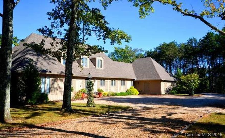 ENCHANTING FRENCH COUNTRY home, 2,925 hsf, 2.70 acs on corner lot, 3 bds, 2.5 bths, lrg liv rm over looking grape vine cov pergola & est manicured lawn. Open concept keeping rm w/mexican tile floor, wd brn fp, wd beamed cath ceiling over dining & den & kitchen overlooks them. Walk-in pantry, laundry w/strg, office w/ext & int entrance & 3 car crprt. Basemnt wrkshp could be exercise rm, play rm, lrg home office etc. Close to Tryon, Columbus, Landrum, shopping, restaurants, hospital, FENCE & TIEC.