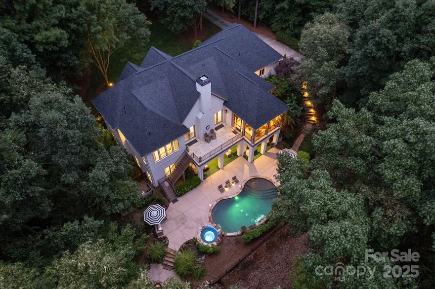 Entertainer's Dream just steps from your boat slip perfectly positioned on 1.64 acres! This Simonini full brick custom home offers main level living at its finest, offering privacy and every detail invites connection, comfort and celebration with beautiful updates and designer finishes throughout. The grand kitchen opens to the living areas perfect for entertaining. Enjoy the spacious owner's suite with luxury bath. Lower level offers 3 guest suites, a bar with wine cellar and home office. The outdoor oasis takes center stage with pool and spa, an outdoor kitchen and relaxing fire-pit. Enjoy the luxury lifestyle of The Point where world class amenities and community events make every day feel like a vacation.