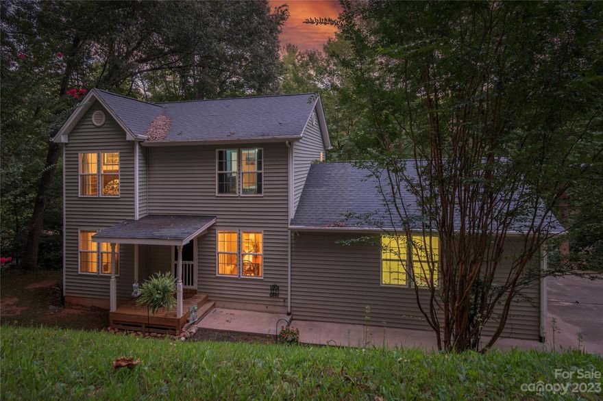 Located in the sought after subdivision of Dogwood Acres you will find this extremely charming home loaded with character and space to spread out!  Only moments to Main St Waynesville and Asheville, this location is the best of both worlds! Updates all around with fresh paint and newer appliances. The living room is expansive with cozy  fireplace.  Living area flows nicely to the breakfast nook, sunroom and updated kitchen.  Separate formal dining area for your upcoming holiday gatherings.  Large master suite with en suite bath upstairs and two more bedrooms/one bath. Downstairs is an expansive finished basement with pool table which conveys. Attached garage.