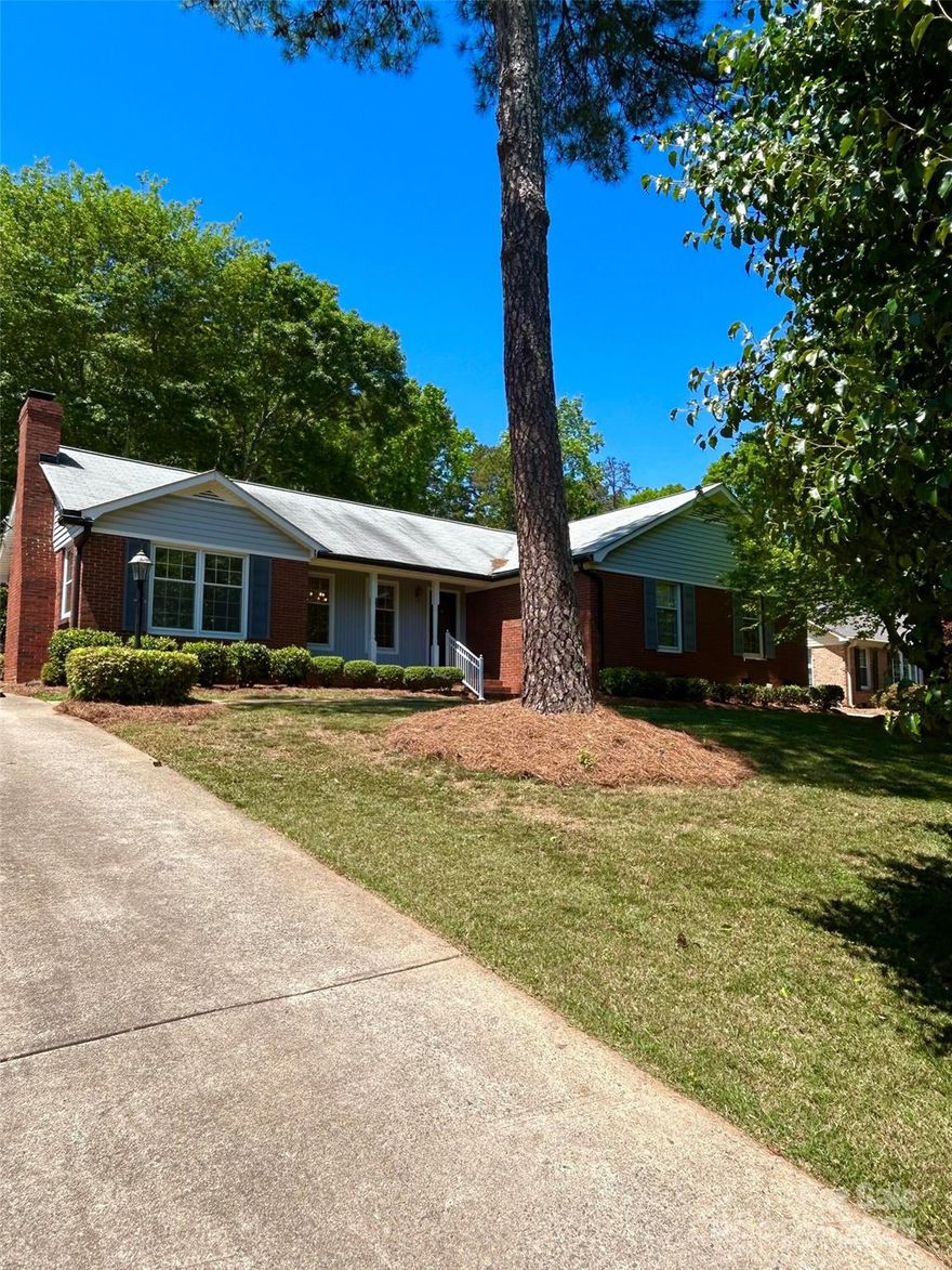 Welcome to this charming ranch home located at 13416 Four Oaks Ln in Matthews, NC. This property features a beautifully landscaped yard, offering a serene setting for outdoor enjoyment including a spacious screened porch, he/she shed with electricity and gas grill. Inside, discover a spacious but cozy floor plan with abundant natural light, newly refinished hardwood floors, new carpet in the bedrooms and living room, and granite counter tops in the kitchen. It also offers a large formal living room/office with floor to ceiling custom bookshelves. The inviting living spaces provide comfort and feelings of home, while the bedrooms accord a peaceful retreat. Conveniently located near local amenities, this home presents a wonderful opportunity for comfortable family living.
