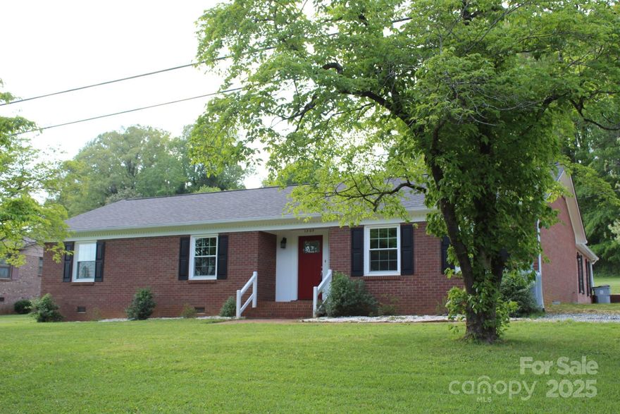 Need one level living with no step entry? Here it is! 4 bedroom, 2 bath, plus home office, plus 2 additional flex spaces with so many possibilities! No step exterior access plus no step interior. ADA compliant doorways. 2023 remodel included windows, architectural shingle roof, lighting & plumbing fixtures, paint, engineered hardwoods throughout & more! Kitchen features granite counters, breakfast bar, pantry, stainless refrigerator, dishwasher & double oven range. Kitchen is open to very spacious dining area. Living room is bright & airy with cozy gas log FP. Primary suite features a bath with shower. Spacious hall bath with tub. Large yard with retractable awning over grassy patio area. Lots of storage space in floored attic area plus 16x10 outbuilding. Located less than a mile from Hibriten High School, William Lenoir Middle, and Lower Creek Elementary schools. Easy access to Hickory or Boone. Beautiful & moderate 4 season climate. High speed internet available.