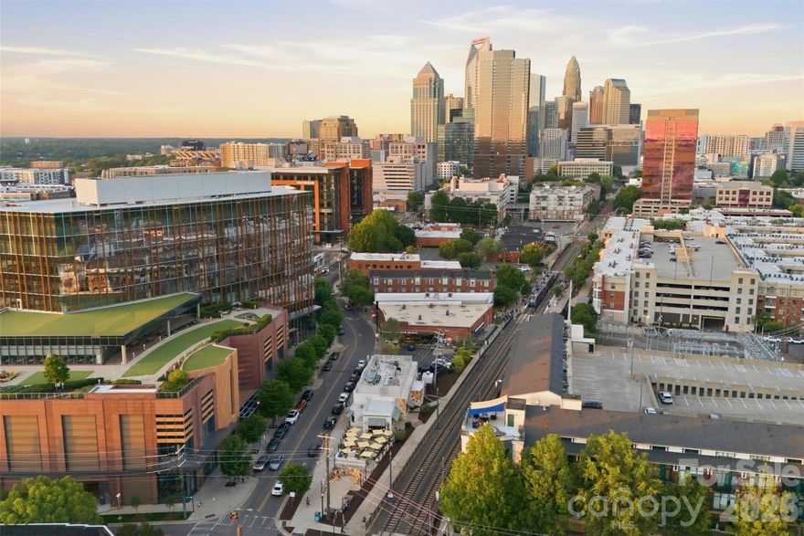 Discover city living at its finest in the heart of South End, one of Charlotte’s most vibrant and desirable neighborhoods. Just outside your door, you’ll find some of the city’s most popular restaurants, breweries, coffee shops, boutiques, and the ever-popular Rail Trail. Inside, floor-to-ceiling windows fill this modern, stylish condo with an abundance of natural light, while tall ceilings create an open, airy feel throughout. Upstairs offers an expansive primary suite with a versatile loft space that can serve as a home office, gym, or cozy sitting room. Enjoy the community rooftop terrace with stunning panoramic views of the Charlotte skyline, the perfect spot to relax or entertain friends. This condo offers the perfect blend of urban living, whether it’s weekend brunch, happy hour, working Uptown, or catching a Panthers game, it’s all right outside your door!