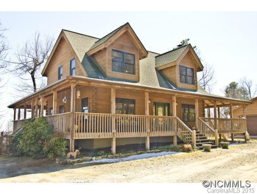 Truly spectacular views from this 3.57 acre home in scenic gated community w waterfalls, hiking, lakes, & acres of beauty.  Stunning hand hewn log home w wrap around porch, large fenced yard w on wooded lot. Stone FP w cathedral ceilings, reclaimed HW floors, slate floors in all BAs/kitchen & utility RM; OFP w unique center staircase. Energy efficient doors/windows, full basement w tons of storage. Large detached garage. 15 min to I40.