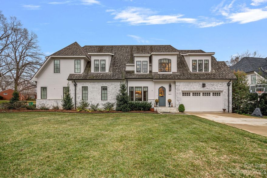 Stunning 4-bedroom townhome perfectly situated on a charming corner lot in the heart of Old Cotswold. Beautiful quality and architectural details throughout. Gorgeous Primary Suite on the main level with walk-in closets and a stunning bath. Striking gourmet kitchen featuring beautiful custom cabinetry, natural stone counters, large center island, Subzero refrigerator, Wolf range, wine coolers and Bosch dishwasher. Open floorplan flows seamlessly, w/ the living room opening to a beautiful, covered porch and enclosed patio offering additional outdoor living space. The upper-level features 3 additional bedrooms, 2 full baths, bonus room, loft area & office area (fabulous flex space). Perfect for remote work! Enjoy low maintenance living w/ its sealed crawlspace, irrigation system and attached 2 car garage. The essence of single-family living in a townhome setting. Prime, pedestrian friendly, location in Cotswold just steps to restaurants and shopping and minutes to Uptown and Southpark.