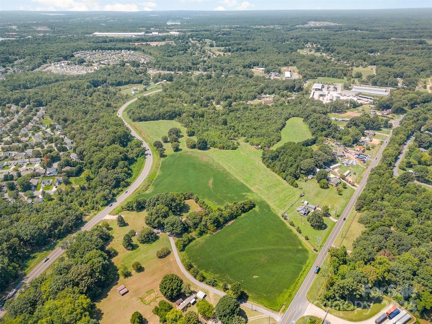 This expansive 14-acre parcel of mostly cleared land in Mooreville presents a unique investment opportunity with immense potential. Located within the 2030 and 2045 Horizon Plan areas, this property is perfectly positioned to benefit from the region's future development and growth. With its generous size and clear, open space, it offers a versatile foundation for various uses, whether you’re envisioning a residential development, agricultural project, or simply holding the land for future appreciation. The property is easily accessible and well-connected to two major roads (Connector Road and NC 115 Highway), making it a strategic choice for those looking to capitalize on Mooresville's expanding landscape. Don’t miss out on this exceptional chance to be part of Mooresville’s promising future.