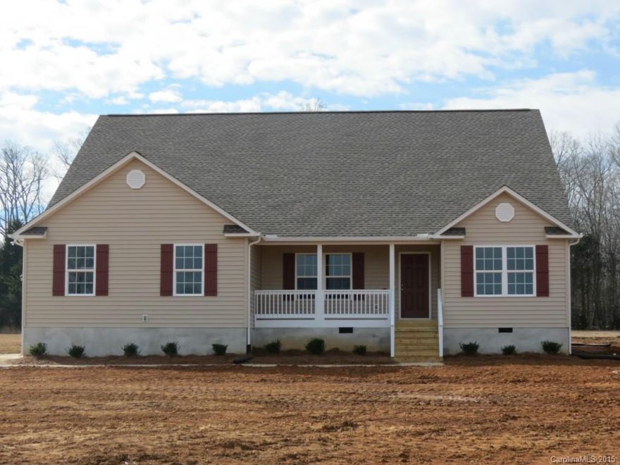Beautiful one story home siting on 6 acres, w/a front porch that overlooks large open yard, as well as a back yard of hardwoods & pines and a covered porch for relaxing and enjoying the privacy. This spacious 3 BR home offers several amenities such as an open split bedroom floor plan, wood floors throughout main living area, and gas fireplace. Eat in kitchen features an island w/breakfast bar, granite countertops & stainless appliances. Price reduction due to builders final construction numbers.