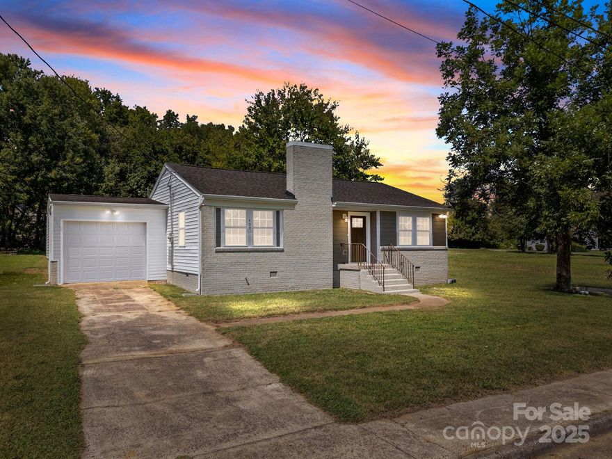 This beautifully renovated home offers true single-level living with every detail thoughtfully updated—plumbing, electrical, HVAC, and more, all with permits pulled. The open-concept floor plan presents a bright living room, dining area, and a gleaming kitchen with granite countertops, tile backsplash, stainless steel appliances, and plenty of cabinetry. A spacious laundry room is conveniently located just off the kitchen. The primary suite features a stunning tiled walk-in shower, while two additional bedrooms and a second bathroom provide comfort for family or guests. An attached one-car garage adds everyday convenience. This home is nothing short of stunning—an absolute must-see!