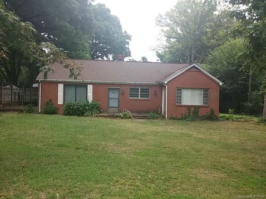 REDUCED FOR QUICK SALE! ATTENTION INVESTORS & FLIPPERS! PRICED TO SELL! BELOW TAX VALUE! All brick home on almost an acre lot, NEW ROOF in 2013 ($6500). Need a little TLC inside, but is a great solid home on a nice large lot. New 200w Electrical Panel installed last year ($1500). Also has a cinder block 2 car detached garage w/electricity, could be an awesome Man Cave or Custom Garage... This home has been a rental for about 15 years at $750/month. Being sold AS IS, no repairs will be made.