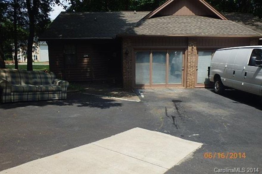 1 bedroom 1 bath end unit. Large living room dining room combination. Eat in kitchen. Garage converted to a heated rec room. Lots of floored attic space. Good investment potential. Interior needs TLC but priced accordingly. Newer roof on these units. Back deck.