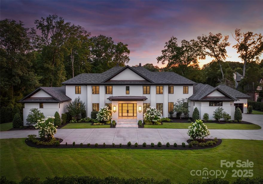 Welcome to Three Little Birds Estate a timeless masterpiece designed by Christopher Phelps Design Group & built by Arcadia Homes. Situated on a private, gated 1.69 acre lot just 2 miles from SouthPark and 6 miles from Uptown Charlotte, this 10,951 sq ft light brick residence blends elegant architecture with modern luxury. The open floor plan features a soaring two-story great room, main-level primary, & seamless flow for entertaining. Step outside to a resort-style backyard with a stunning pool, cabana, and a separate wellness building complete with a full gym, sauna, and steam shower. A sports court, expansive lawn for family fun, and 4-car garage complete the package. Fully fenced with high-level security, this one-of-a-kind estate offers unparalleled privacy, amenities, & location.