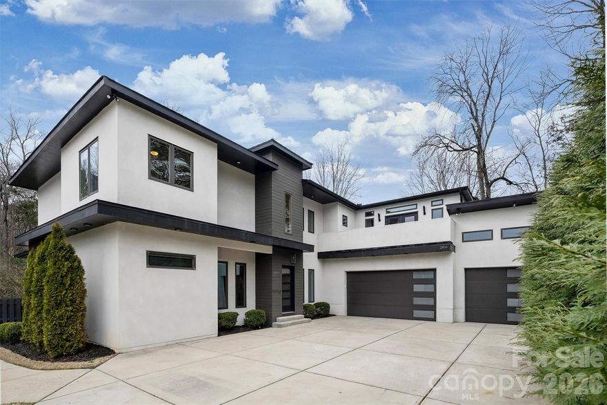Welcome to 2934 Springs Drive, a striking modern home tucked away in a private South Charlotte neighborhood. This 5-bedroom, 3.5-bath residence showcases a clean architectural aesthetic, spacious living areas, and an oversized three-car garage. Enjoy outdoor living with a large deck featuring a fireplace—perfect for entertaining—overlooking a fenced backyard. Conveniently located near The Arboretum Shopping Center and Ballantyne, offering excellent restaurants, breweries, retail, and parks nearby. Don’t miss this opportunity to own a modern home in a sought-after South Charlotte location with incredible access to dining, entertainment, and everyday amenities.