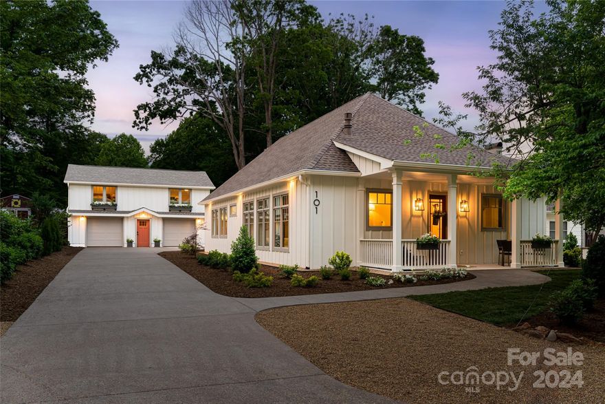 STUNNING NEW CONSTRUCTION WITH CARRIAGE HOUSE IN DOWNTOWN BLACK MOUNTAIN! Thoughtfully designed and built with the highest quality construction and finishes. Main home offers a smart open floor plan with abundant natural light and in-floor radiant heat on the first level. Primary bedroom suite with private bath and WIC on first level. Spectacular kitchen with quartz countertops open to dining and living room with fireplace and modern, monorail staircase. Upper level features an open loft/flex space and private bedroom with ensuite bath. The two-car garage and upper-level 2/1 apartment, originally built in 1940,  have been completely redone down to the studs to match the quality and effective age of the main home. Desirable, walkable location in the heart of Historic Black Mountain.