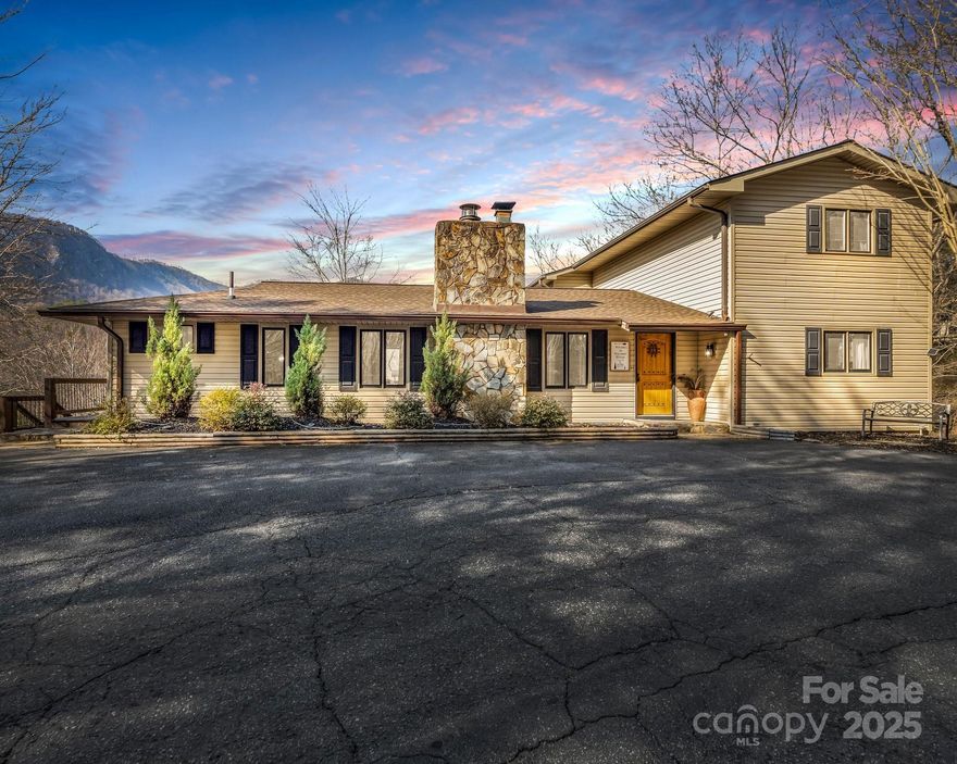 Featured on HGTV’s Lakefront Bargain Hunt!
This beautifully updated and spacious home is located just behind the gates of Rumbling Bald Resort, nestled on a quiet, private street and nearly an acre of land. Offering both charm and modern updates, this property is perfect as a primary residence, vacation getaway, or investment opportunity.

Step inside to discover two generous living areas, ideal for entertaining or relaxing. The home boasts a fully updated kitchen, renovated bathrooms, and new flooring throughout—making it completely move-in ready.

Enjoy mountain living at its finest on two expansive decks. Cozy up by the firepit while watching breathtaking year-round sunsets, or sip your morning coffee as you breathe in the fresh mountain air.

With plenty of space to gather or spread out, this home offers the best of both comfort and convenience—all within the sought-after Rumbling Bald community, complete with resort amenities.