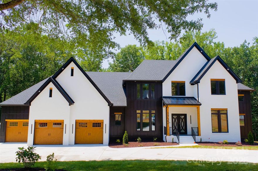 Welcome to this stunning modern farmhouse on 1.5 acres in highly desirable Waxhaw, NC. This 4-bedroom home blends charm and luxury with 11-foot ceilings on the main floor, 9-foot ceilings upstairs, and an oversized garage perfect for car lovers.

Enjoy the entertainer’s dream rear patio, two accordion doors, and a sleek bar area for seamless indoor-outdoor living. Custom touches abound—accent walls, a Himalayan salt wall in the spa-like bath and sauna, plus triple-pane Duretex windows throughout.

Upstairs, find a theater room, home office, and ample storage. This home is crafted for those who crave style, space, and comfort in one perfect Waxhaw setting.