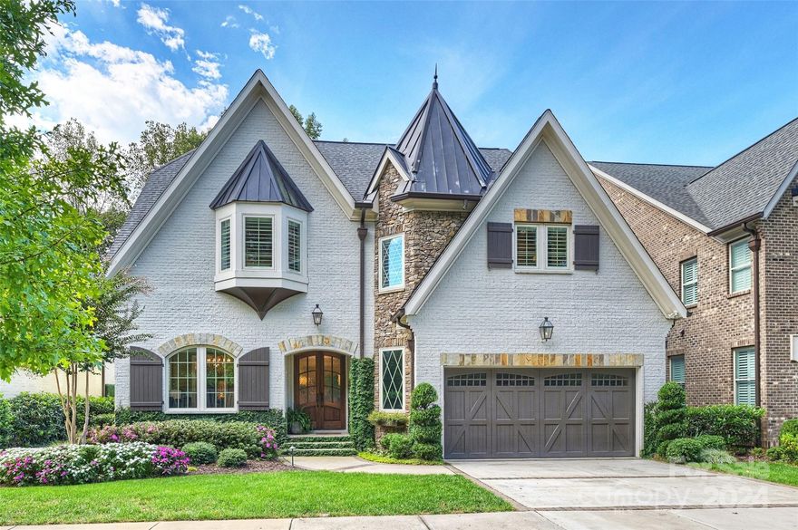 Nestled in the prestigious SouthPark neighborhood, this 2017 built white brick home is a masterpiece of contemporary design & exquisite craftsmanship. Upon entering, you'll be greeted by high ceilings, rich wood moldings, natural light and high end finishes. The attention to detail is simply stunning. The heart of this residence is undoubtedly the chef's kitchen, which boasts Wolf and Sub-Zero appliances and luxury cabinetry & finishes. Flanked by the brick & copper bar, it's the perfect space for culinary enthusiasts and those who love to entertain. The main level primary bedroom, offers a serene retreat with luxurious bathroom & custom closet. Circular staircase with rich design finishes leads to four bedrooms, three baths & office upstairs. The open floor plan has accordion doors that seamlessly connect the indoors with the outdoors. The covered patio with motorized screens. opens to the patio, surrounded by meticulously landscaped grounds & fireplace, provides the perfect setting.
