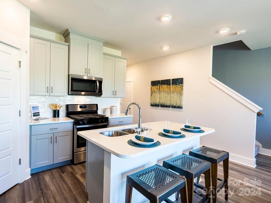 Brand new, energy-efficient home available NOW! Prep dinner at the kitchen island while mingling with guests in the open-concept area. Convenient upstairs laundry simplifies the chores. Linen cabinets, milky white quartz countertops, tan tone EVP flooring with natural ivory carpet in our Divine. Georgetown Crossing is now selling in Kannapolis, NC and is surrounded by the best shopping, dining and entertainment Concord and Kannapolis have to offer. Plus, homeowners can enjoy walkability to Cabarrus County schools and easy access to I-85. Schedule a community tour today to see the benefits of our low maintenance townhomes that boast energy-efficient features.  Each of our homes is built with innovative, energy-efficient features designed to help you enjoy more savings, better health, real comfort and peace of mind.